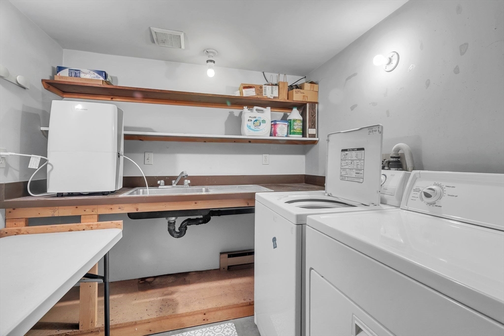 64 Heatherstone Road Amherst, MA 01002 - Photo 33 of 42 a utility room with dryer and washer