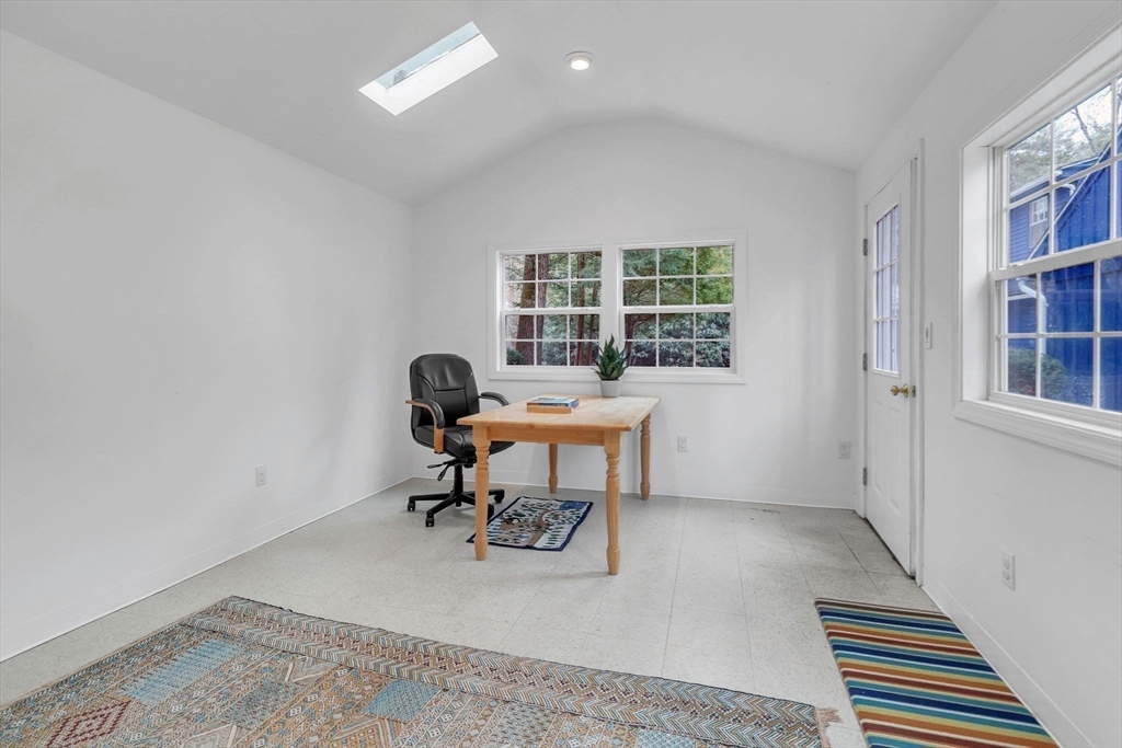 64 Heatherstone Road Amherst, MA 01002 - Photo 36 of 42 a view of a workspace with furniture and a window