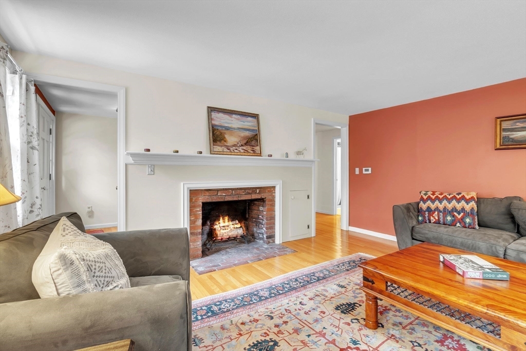 64 Heatherstone Road Amherst, MA 01002 - Photo 6 of 42 a living room with furniture and a fireplace
