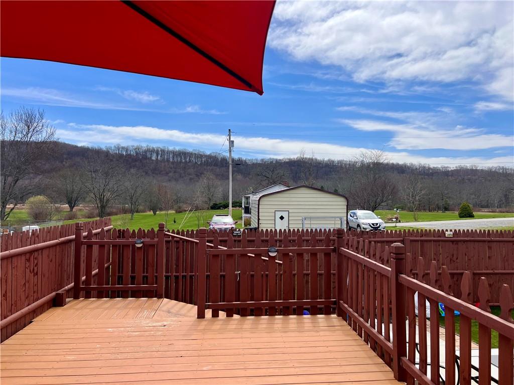 1008 Main Street East Rural Valley, PA 16249 - Photo 11 of 24 a view of a balcony with wooden floor and outdoor space