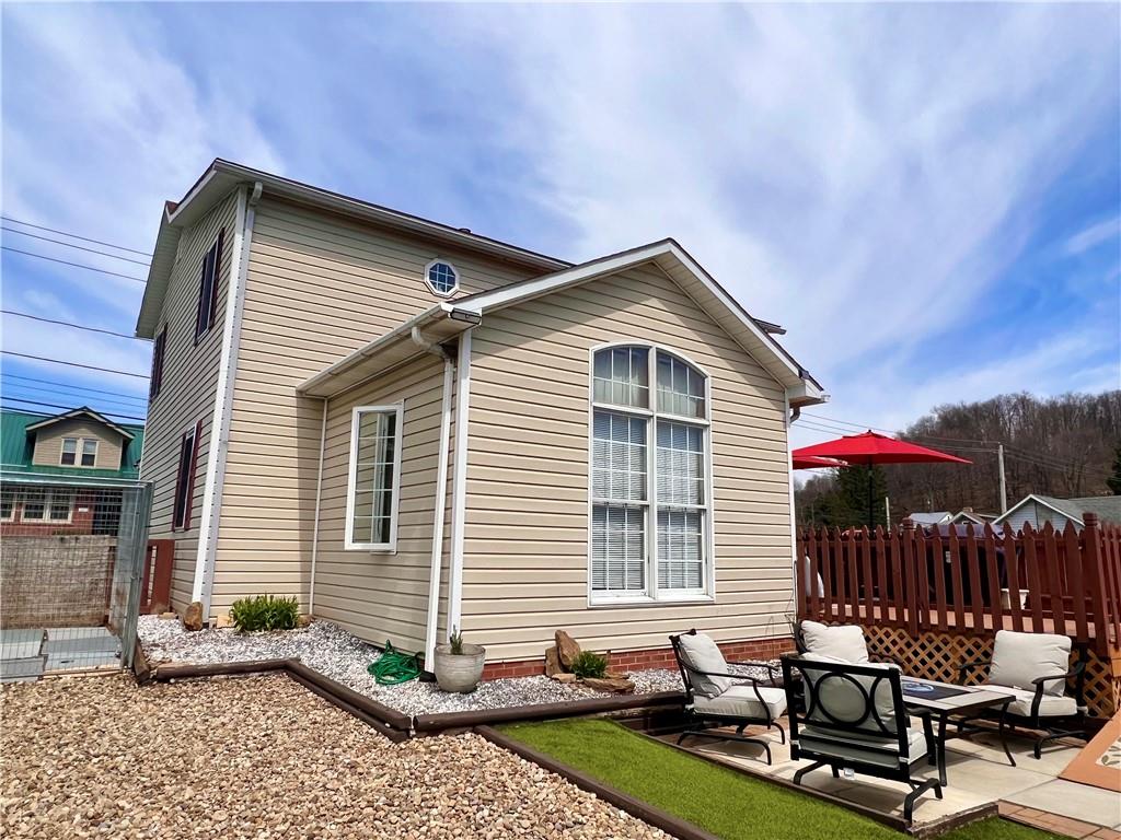 1008 Main Street East Rural Valley, PA 16249 - Photo 8 of 24 a front view of house with yard outdoor seating and barbeque oven