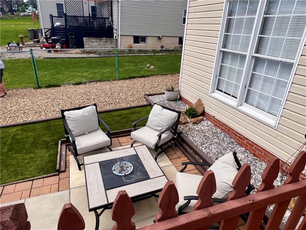 1008 Main Street East Rural Valley, PA 16249 - Photo 9 of 24 a view of a patio with table and chairs and potted plants