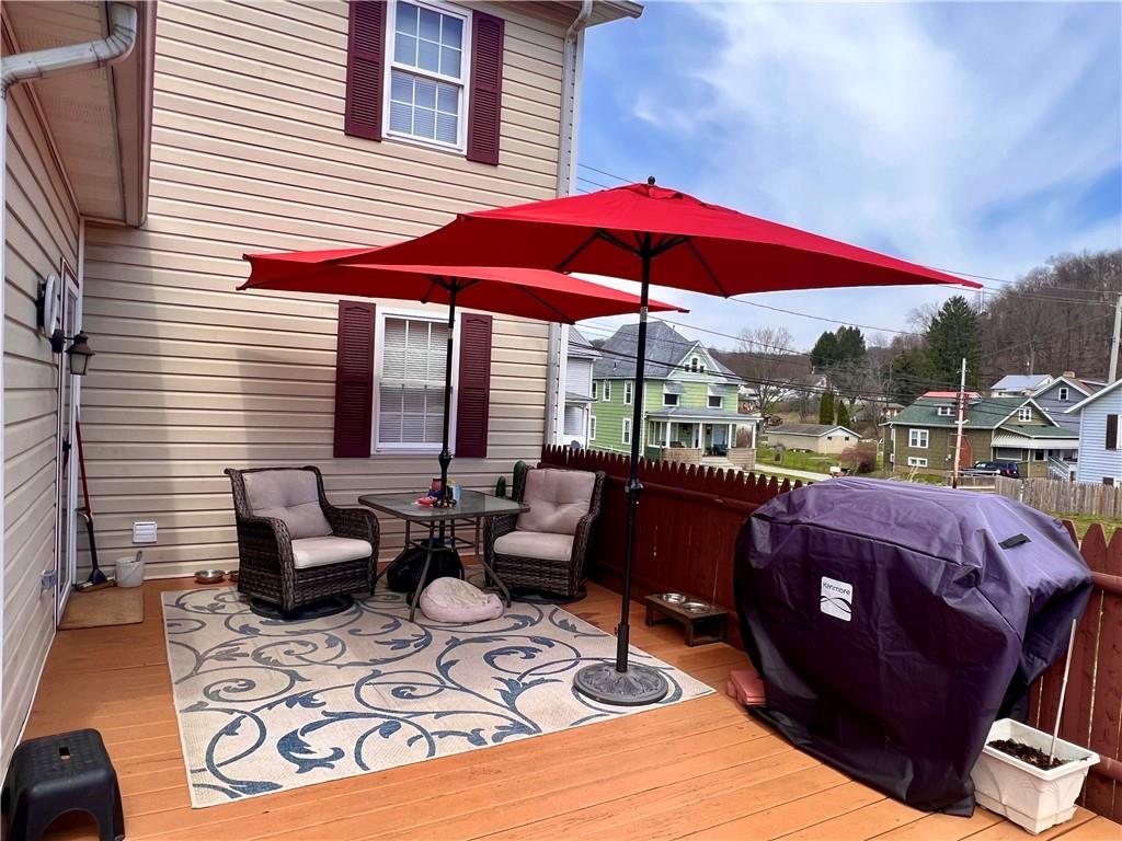 1008 Main Street East Rural Valley, PA 16249 - Photo 10 of 24 a view of a patio with couches chairs under an umbrella