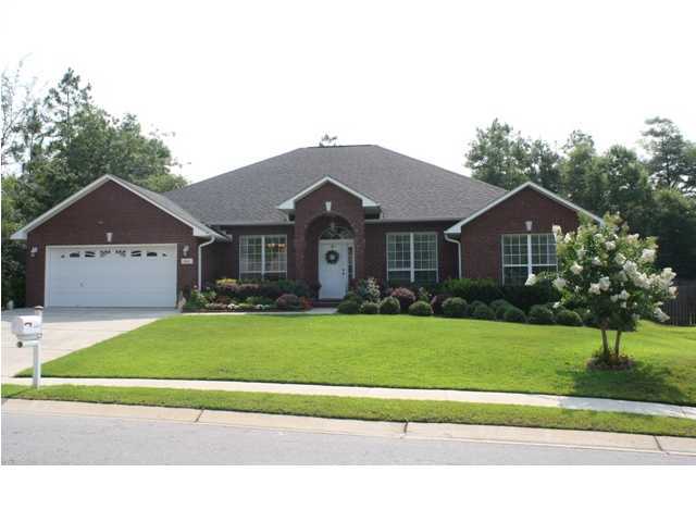 660 Territory Lane Crestview, FL 32536 - Photo 1 of 15 a front view of a house with a yard and garage