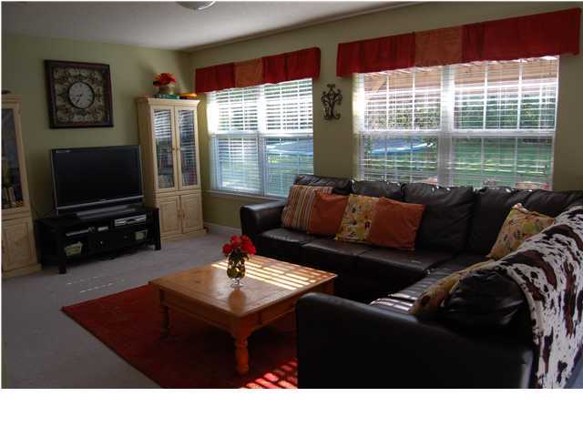 660 Territory Lane Crestview, FL 32536 - Photo 14 of 15 a living room with furniture and a flat screen tv