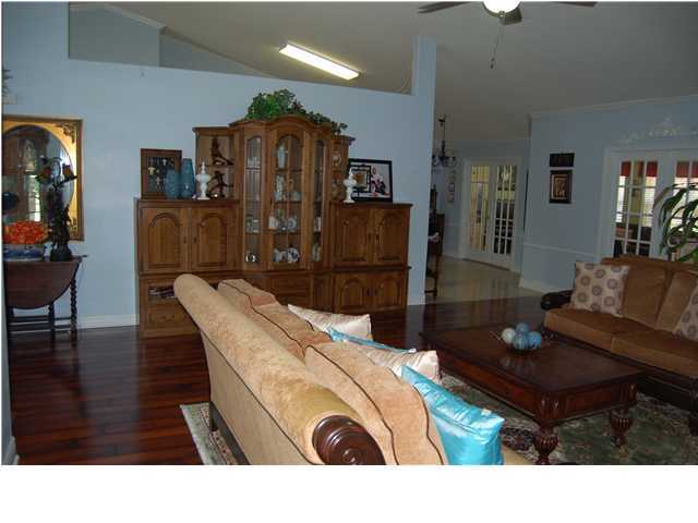 660 Territory Lane Crestview, FL 32536 - Photo 3 of 15 a living room with furniture and wooden floor