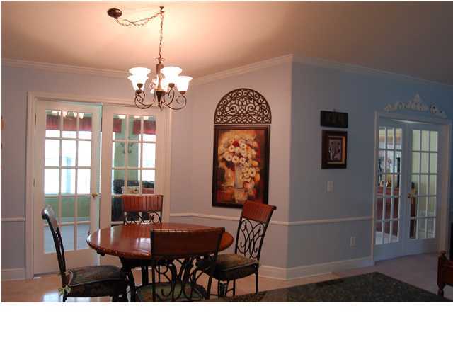 660 Territory Lane Crestview, FL 32536 - Photo 7 of 15 a view of a dining room with furniture and a chandelier