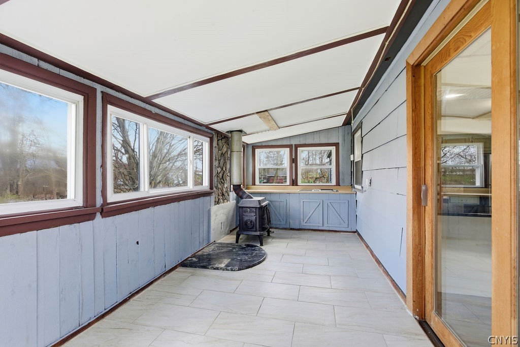 5960 Newport Road Camillus, NY 13031 - Photo 20 of 45 3 season porch off kitchen with wood stove