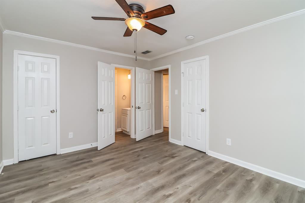 4117 Hatcher Street Fort Worth, TX 76119 - Photo 9 of 16 wooden floor in an empty room with a window