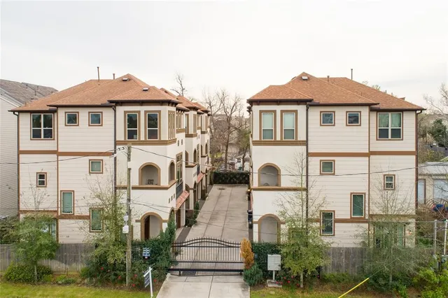 a bathroom with a granite countertop sink a toilet and a mirror