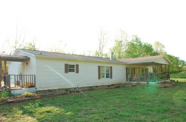 200 Old Railroad Road Prospect, TN 38477 - Photo 1 of 20 a backyard of a house with table and chairs