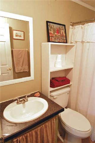 200 Old Railroad Road Prospect, TN 38477 - Photo 13 of 20 a bathroom with a toilet sink and mirror