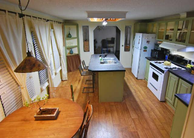 200 Old Railroad Road Prospect, TN 38477 - Photo 5 of 20 a living room with stainless steel appliances furniture a rug and a kitchen view