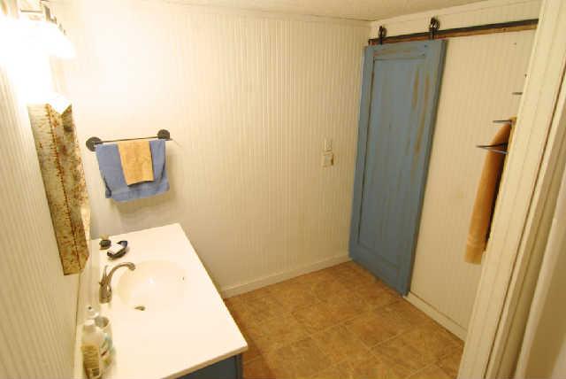 200 Old Railroad Road Prospect, TN 38477 - Photo 9 of 20 a bathroom with a sink mirror and shower