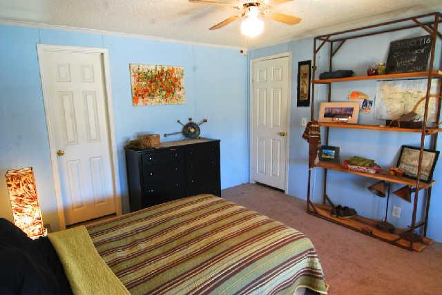 200 Old Railroad Road Prospect, TN 38477 - Photo 10 of 20 a bedroom with a bed and wooden floor