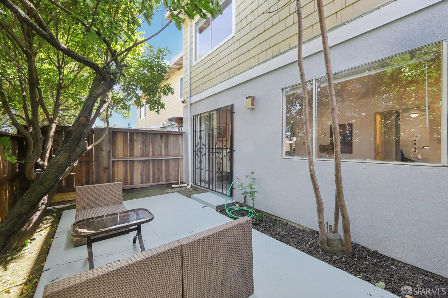 134 Albatross Court San Francisco, CA 94124 - Photo 19 of 40 a backyard of a house with table and chairs