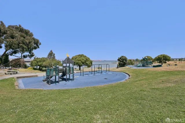 a view of a backyard with table and chairs