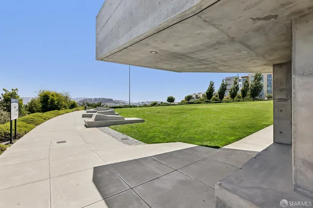 a backyard of a house with yard and outdoor seating