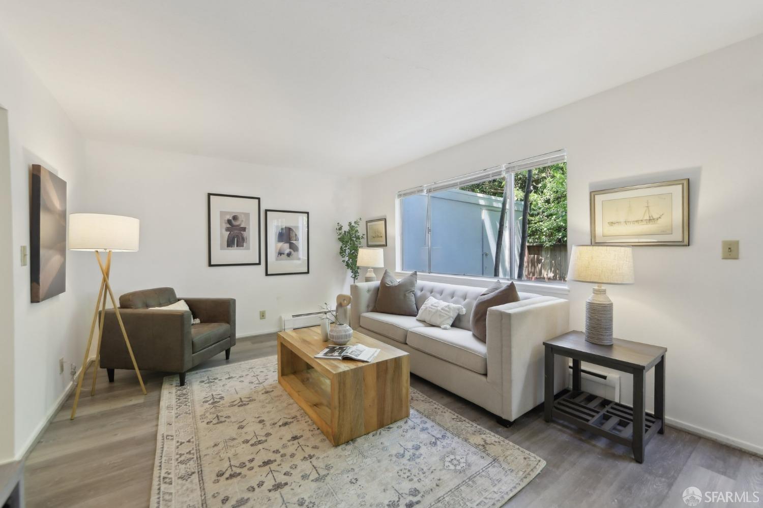 134 Albatross Court San Francisco, CA 94124 - Photo 3 of 40 a living room with furniture and a large window