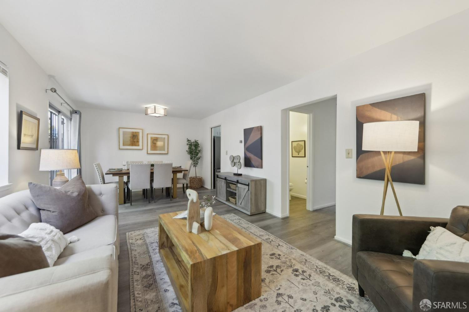 134 Albatross Court San Francisco, CA 94124 - Photo 4 of 40 a living room with furniture and a wooden floor