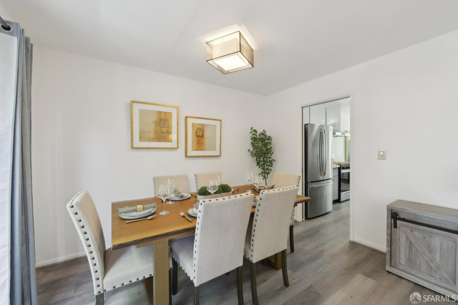134 Albatross Court San Francisco, CA 94124 - Photo 6 of 40 a view of a dining room with furniture and a chandelier