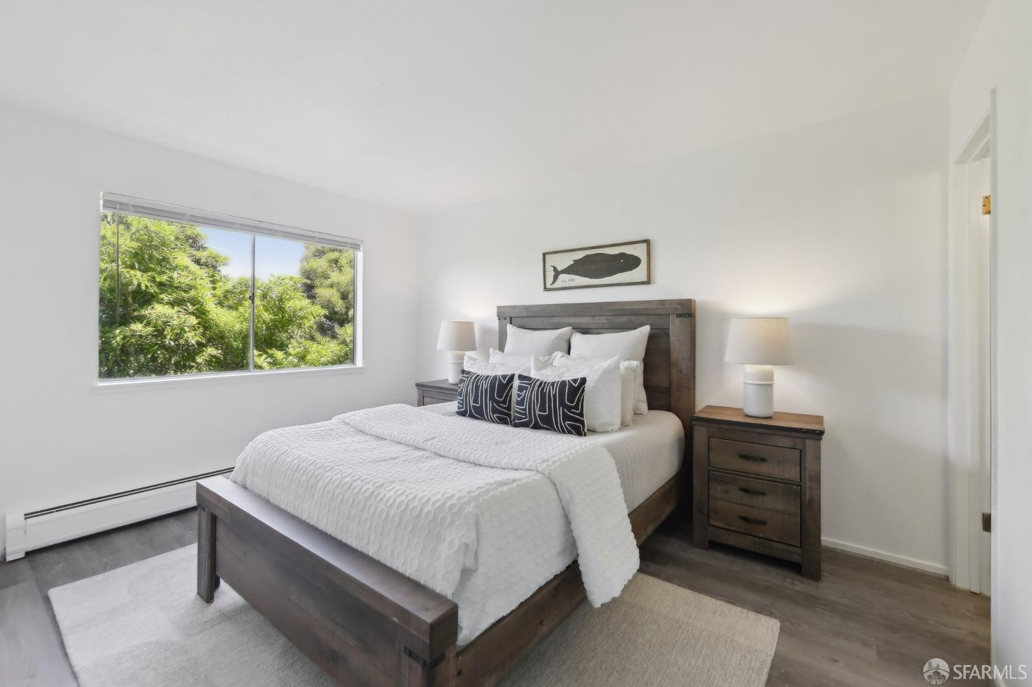 134 Albatross Court San Francisco, CA 94124 - Photo 9 of 40 a bedroom with a bed and a window