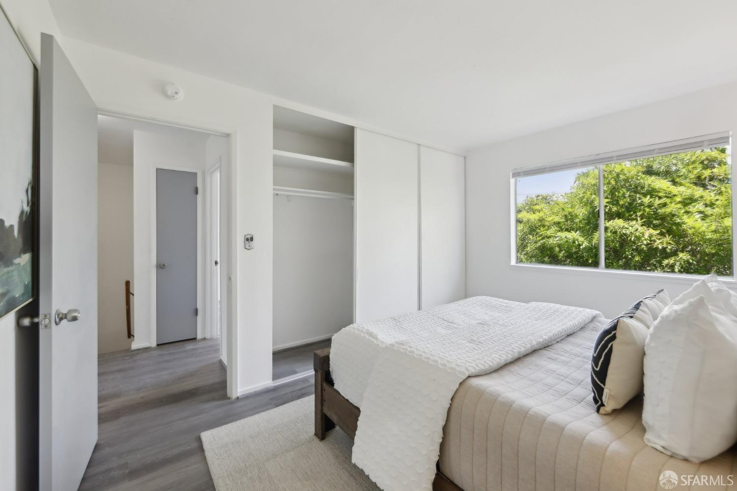 134 Albatross Court San Francisco, CA 94124 - Photo 10 of 40 a bedroom with a bed and a window