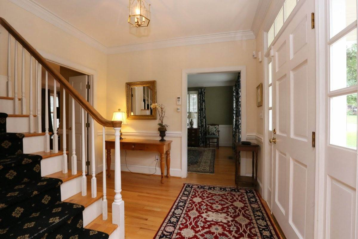 3200 Anderson Drive Raleigh, NC 27609 - Photo 3 of 25 Upon entering home will notice the hardwood floors that will continue throughout home. Detailed moldings, hardwood staircase with runner and neutral decor. This home is move in ready! Foyer