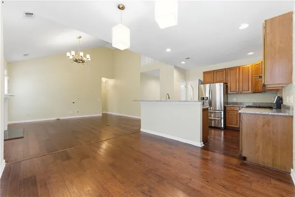 a view of kitchen with cabinets and stainless steel appliances