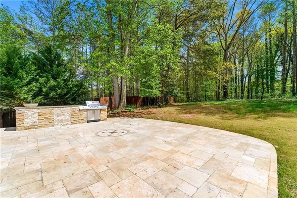 a view of swimming pool with a patio