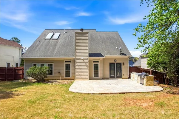 a view of house with yard