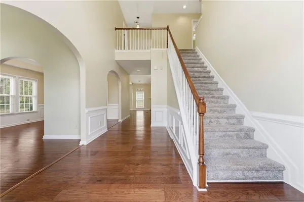 a view of an entryway with wooden floor