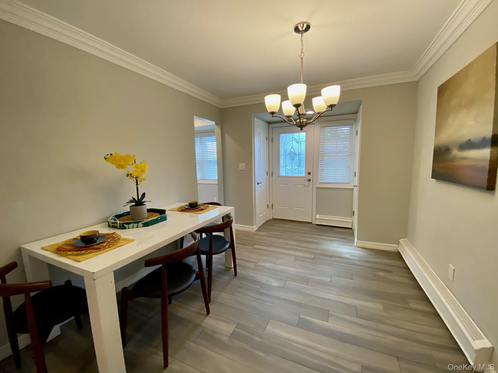 305 Terrace Road, Unit T07305 Bayport, NY 11705 - Photo 6 of 14 a view of a room with a table and chairs