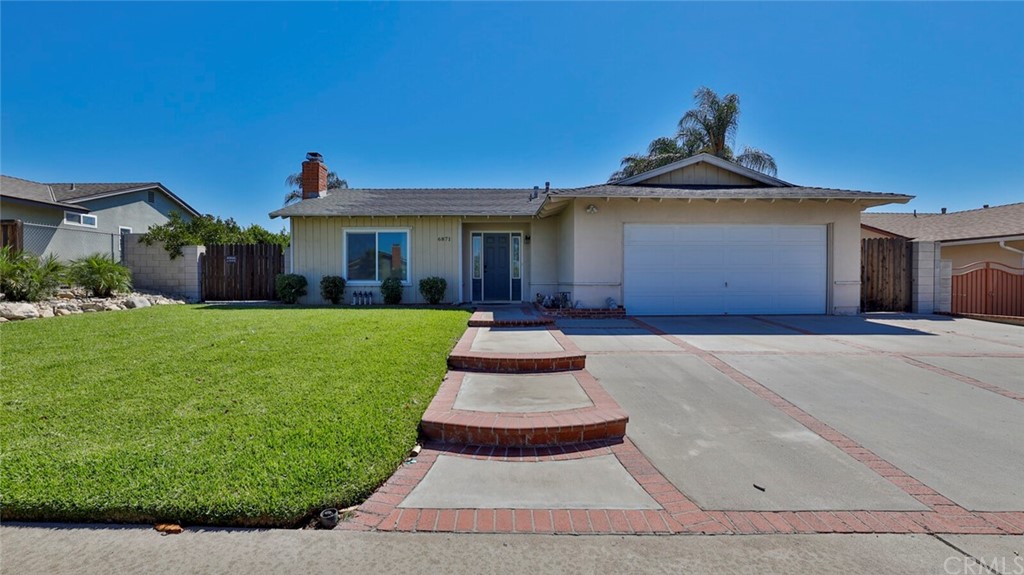 6871 Opal Street Rancho Cucamonga, CA 91701 - Photo 1 of 1 a front view of a house with a yard