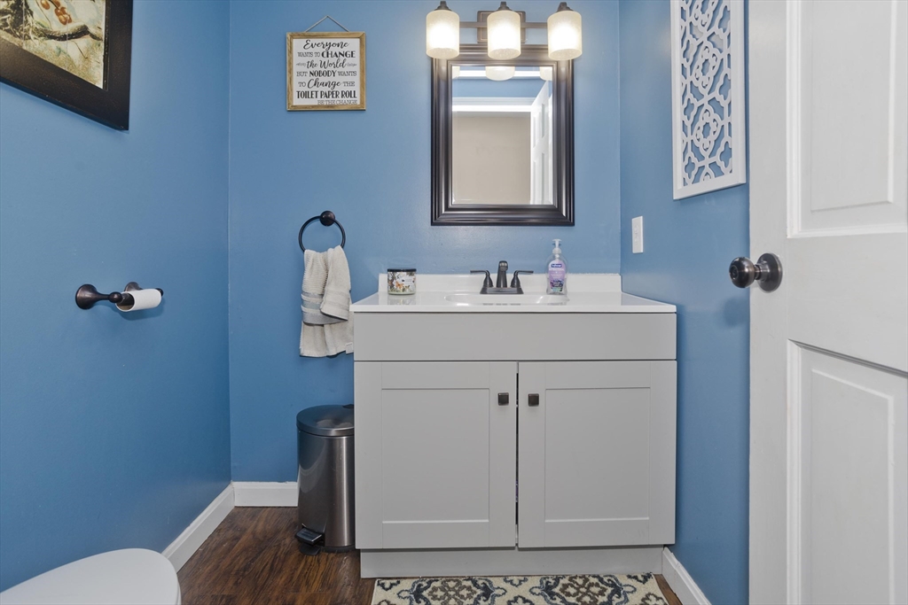 391 Plumtree Road Springfield, MA 01118 - Photo 17 of 42 a bathroom with a sink mirror and toilet