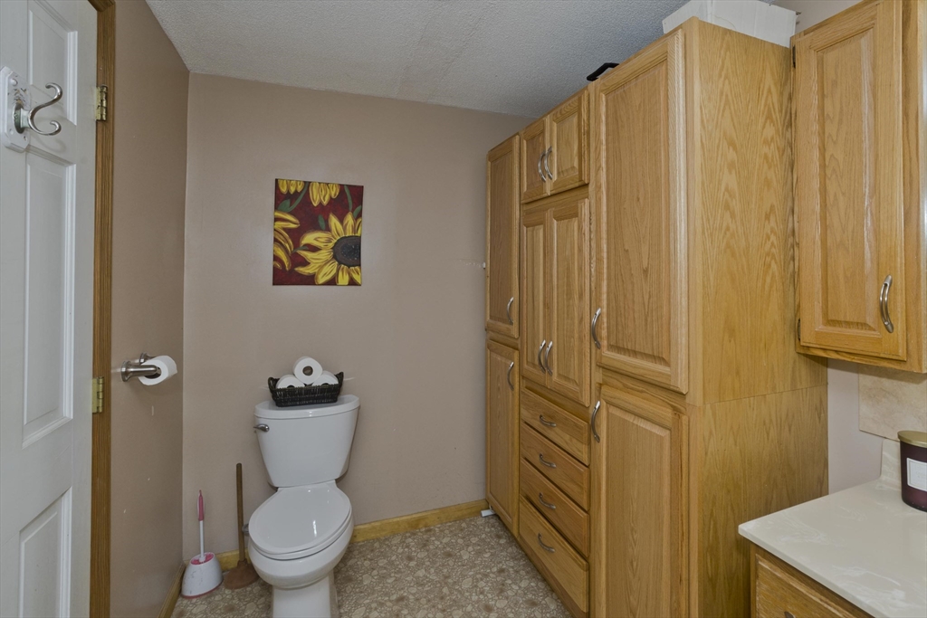 391 Plumtree Road Springfield, MA 01118 - Photo 21 of 42 a bathroom with a toilet a sink and shower