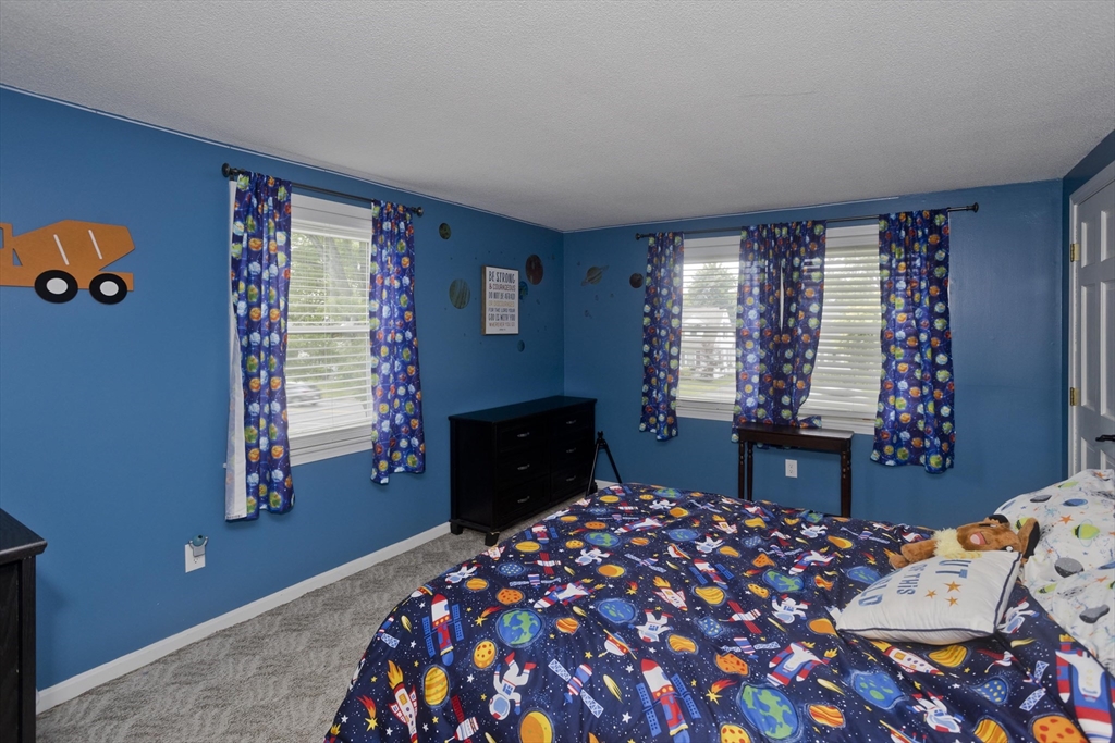 391 Plumtree Road Springfield, MA 01118 - Photo 26 of 42 a bedroom with a bed and a window