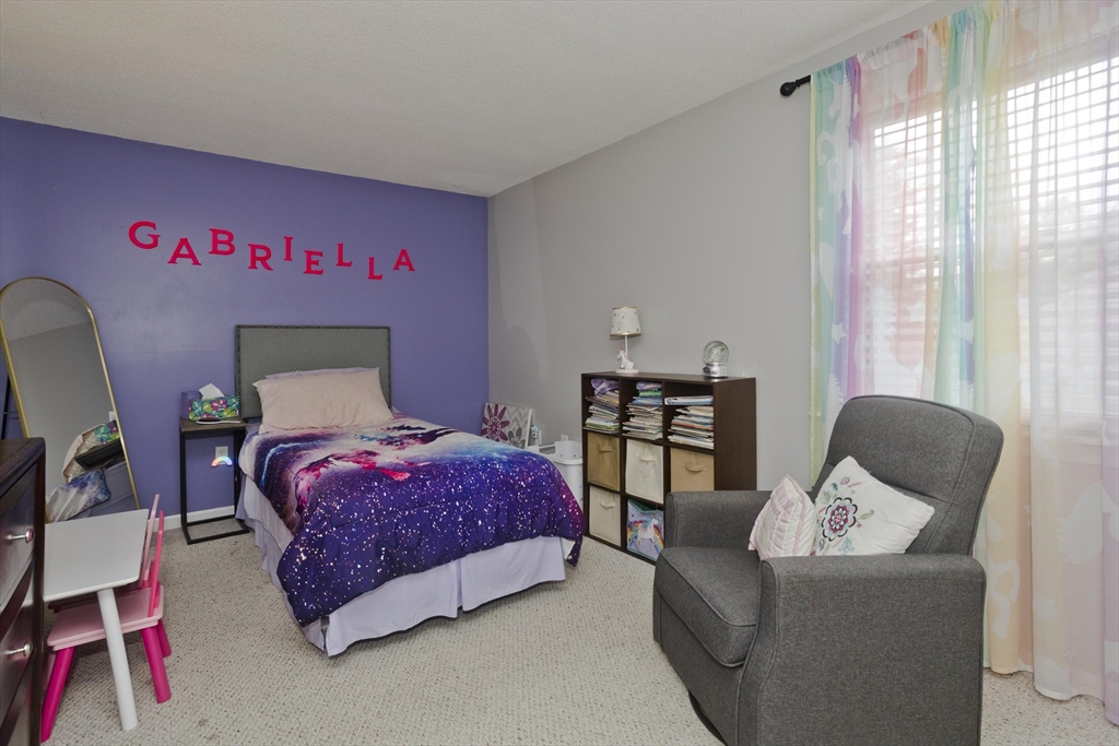 391 Plumtree Road Springfield, MA 01118 - Photo 28 of 42 a bedroom with a bed and a couch