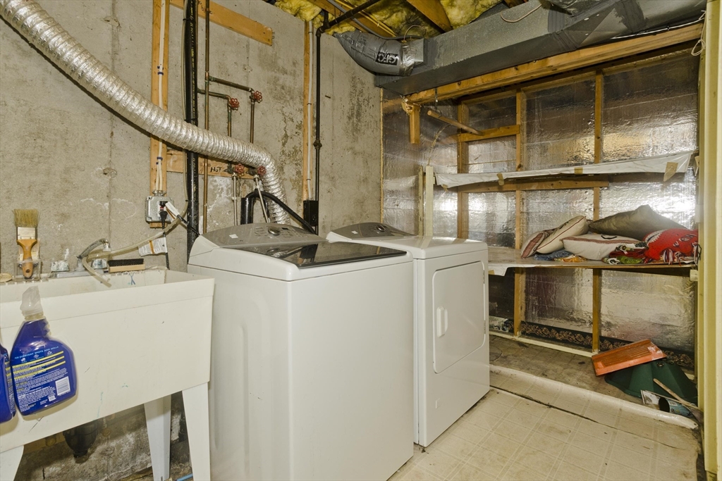 391 Plumtree Road Springfield, MA 01118 - Photo 36 of 42 a utility room with dryer and washer