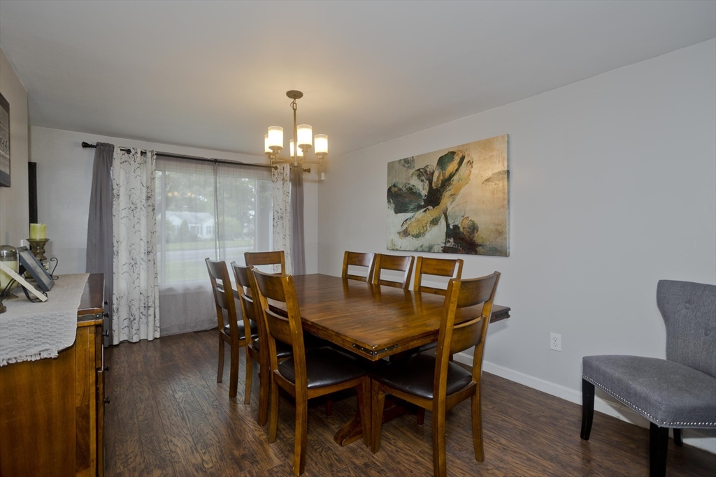 391 Plumtree Road Springfield, MA 01118 - Photo 8 of 42 a view of a dining room with furniture and wooden floor