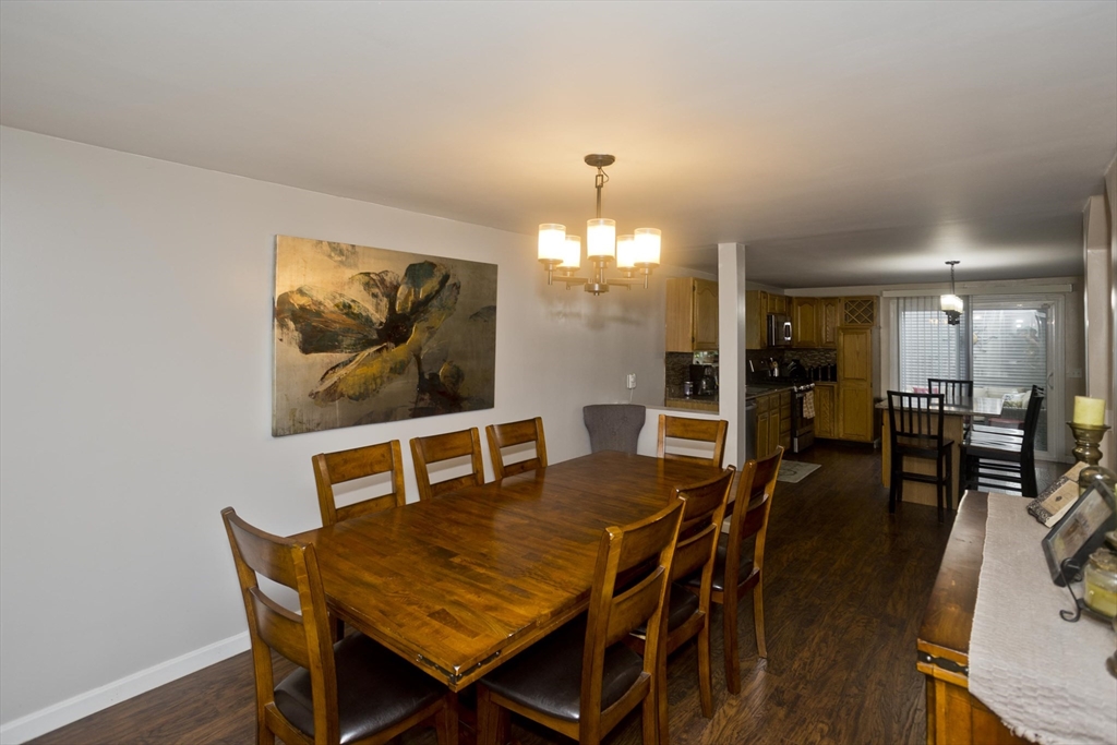 391 Plumtree Road Springfield, MA 01118 - Photo 9 of 42 a view of a dining room with furniture and wooden floor