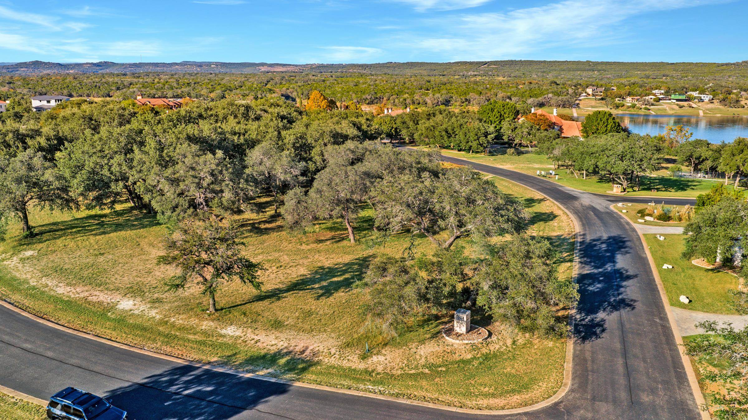 25700 Cliff Circle Spicewood, TX 78669 - Photo 23 of 25 a view of a swimming pool with a lake view