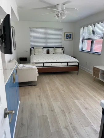 a bedroom with furniture and a window