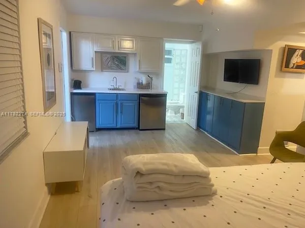 a bedroom with a bed and a television in it