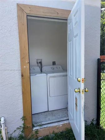 a utility room with dryer and washer