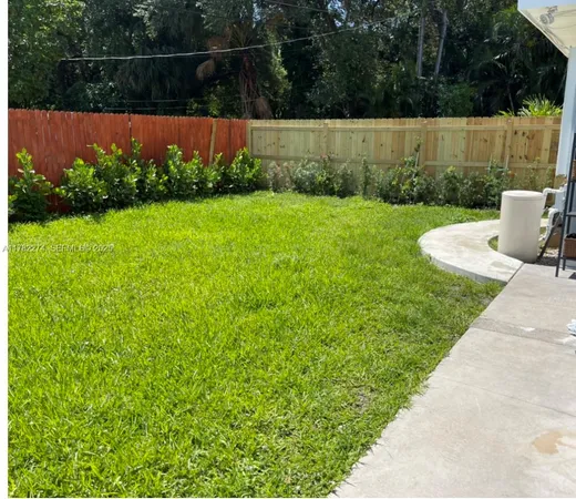 a view of garden with deck in the background