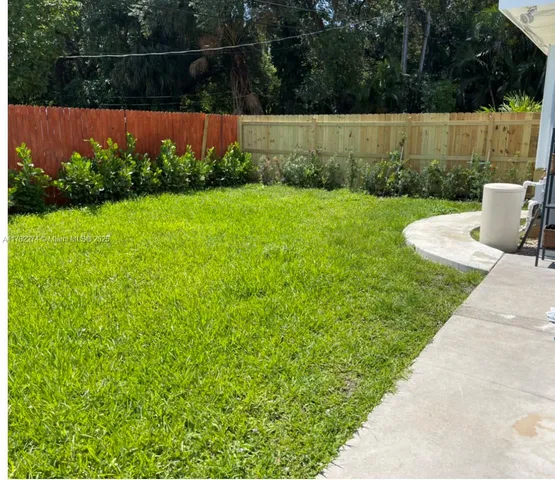 a view of garden with deck in the background