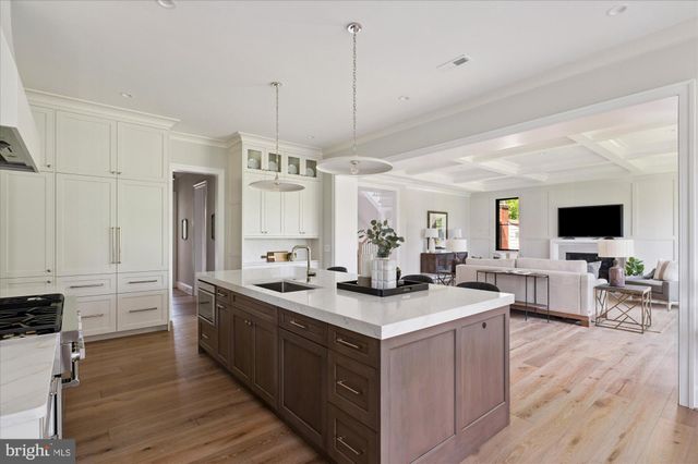 a balcony with couple of chairs and a couch