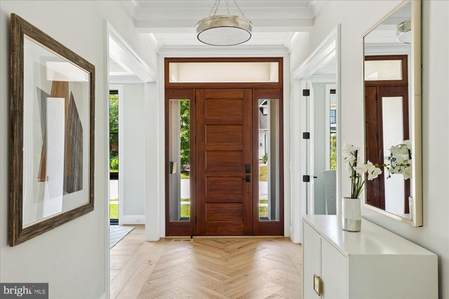 a living room with furniture a window and a table