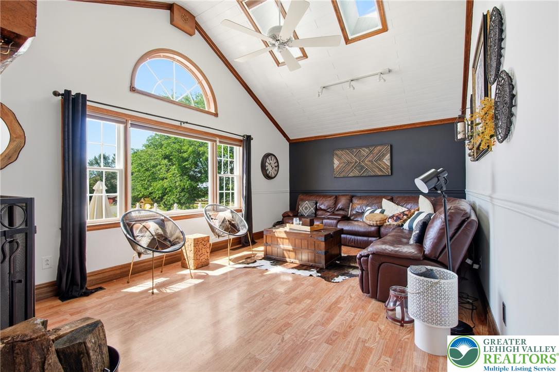 890 Lahr Road Nazareth, PA 18064 - Photo 18 of 71 A vaulted ceiling, skylights, and expansive windows bathe this cozy living area in abundant natural light.